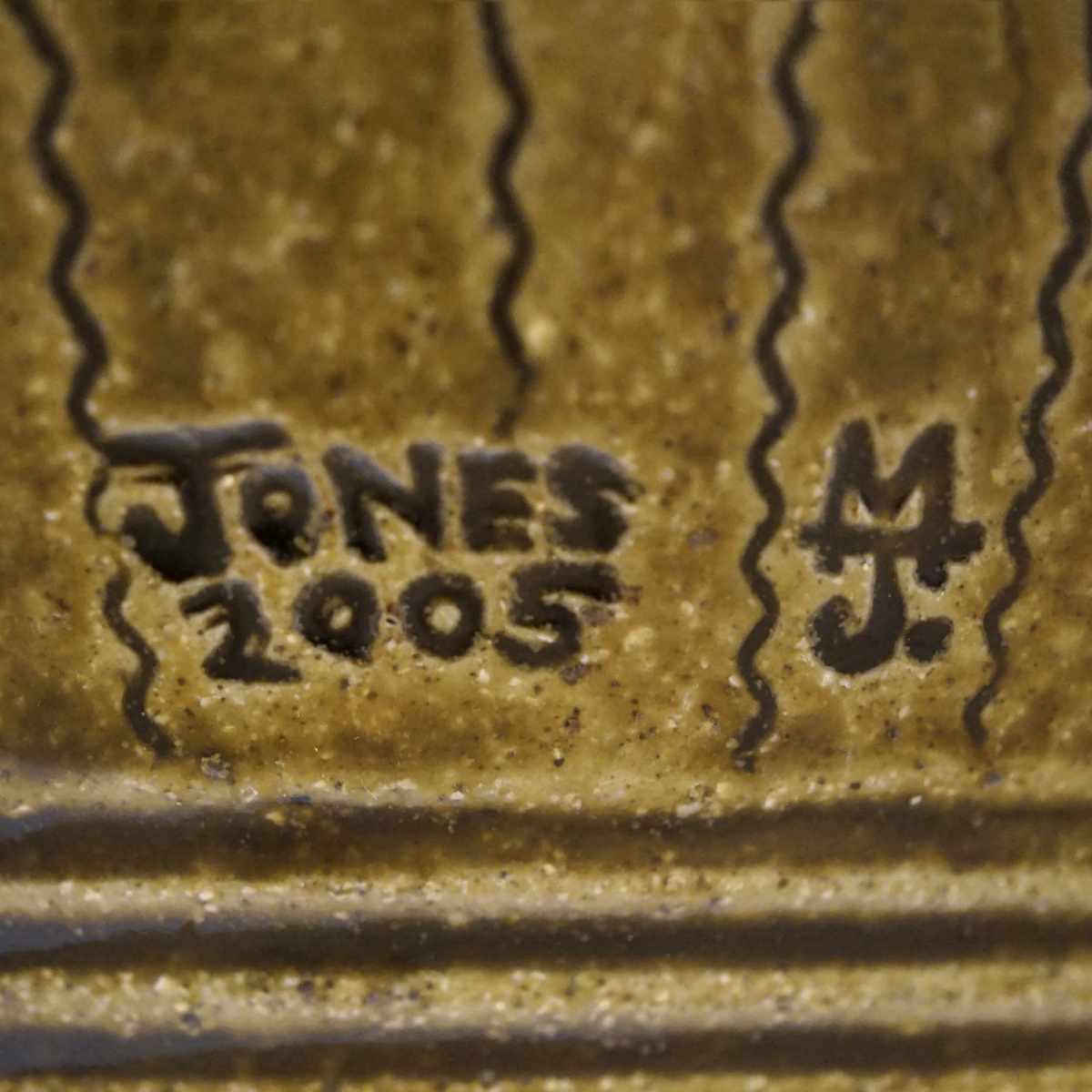 Image of Mark and Signature Jones 2005 MJ on undefined, on the - None -, Inscribed, in the shape of a Rectangle with the letters e, j, n, o, s, 